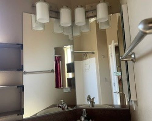 #266 Bath room has shower over tub & cabinets